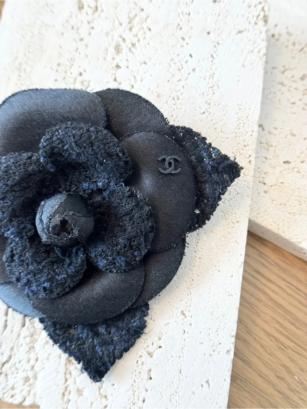 CHANEL Camélia Brooch crafted from black tweed/canvas